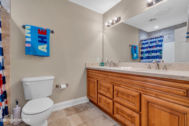 bathroom with vanity, toilet, tile patterned floors, and a shower with curtain