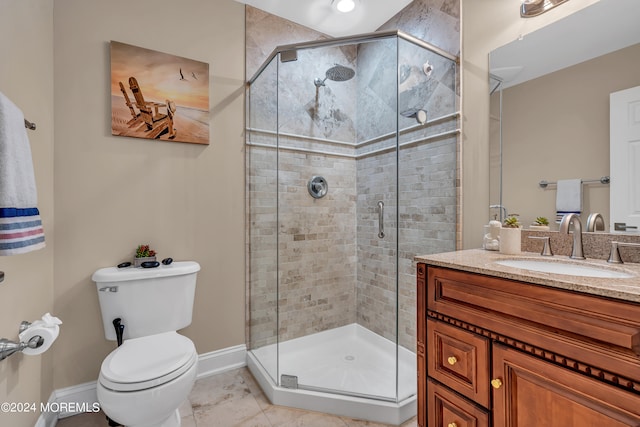 bathroom with tile patterned flooring, vanity, toilet, and an enclosed shower