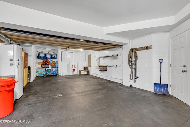 garage with white refrigerator