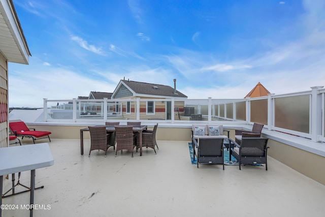 view of patio featuring a balcony