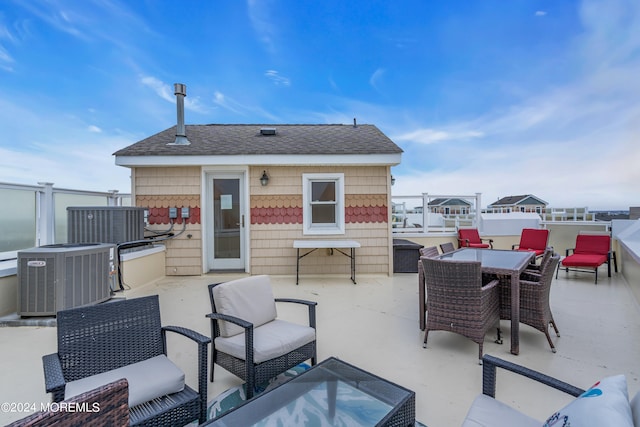 view of patio / terrace with outdoor lounge area and central air condition unit