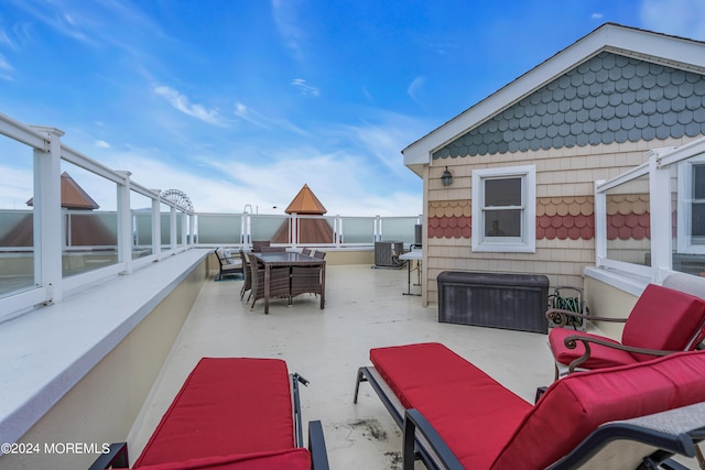 view of patio / terrace featuring a balcony, central AC, and an outdoor hangout area