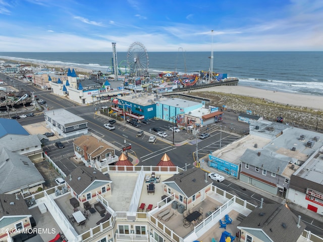 drone / aerial view featuring a view of the beach and a water view