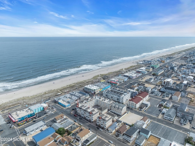 drone / aerial view with a view of the beach and a water view