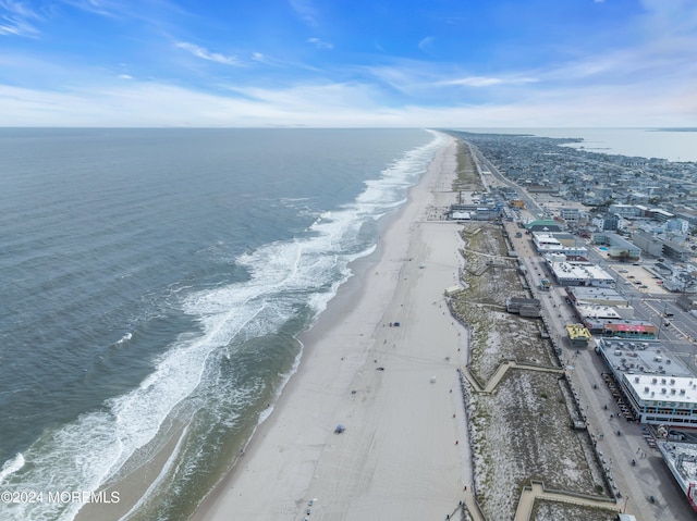 bird's eye view with a beach view and a water view