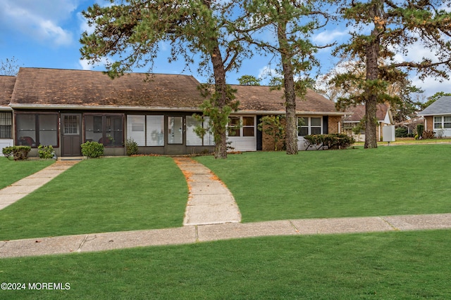 ranch-style home with a front yard