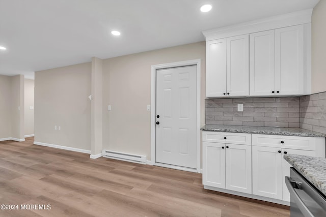 kitchen featuring white cabinetry, stainless steel dishwasher, light wood-type flooring, and a baseboard heating unit