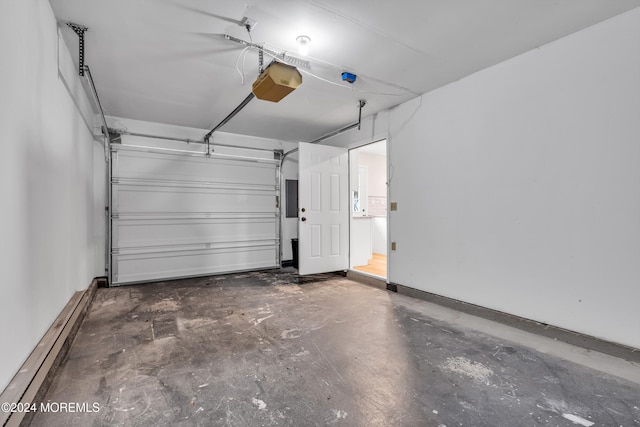 garage with baseboard heating and a garage door opener