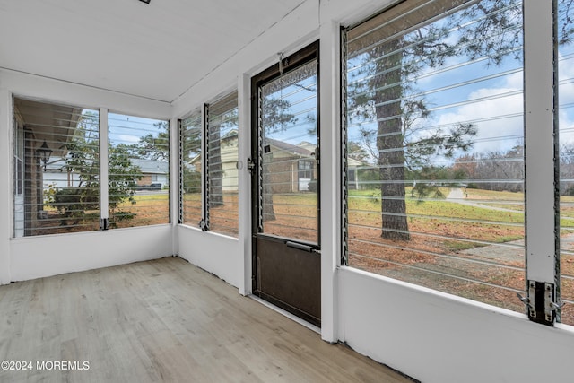 unfurnished sunroom featuring a wealth of natural light