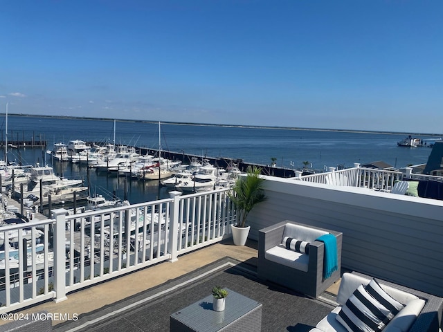 exterior space with an outdoor hangout area and a water view