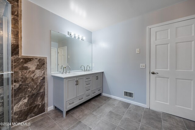 bathroom featuring tile patterned floors and vanity