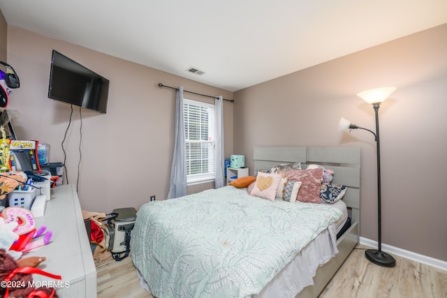 bedroom with light wood-type flooring