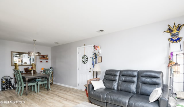 living room with light hardwood / wood-style flooring