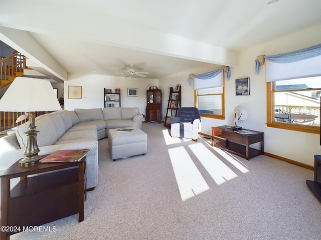 carpeted living room featuring ceiling fan