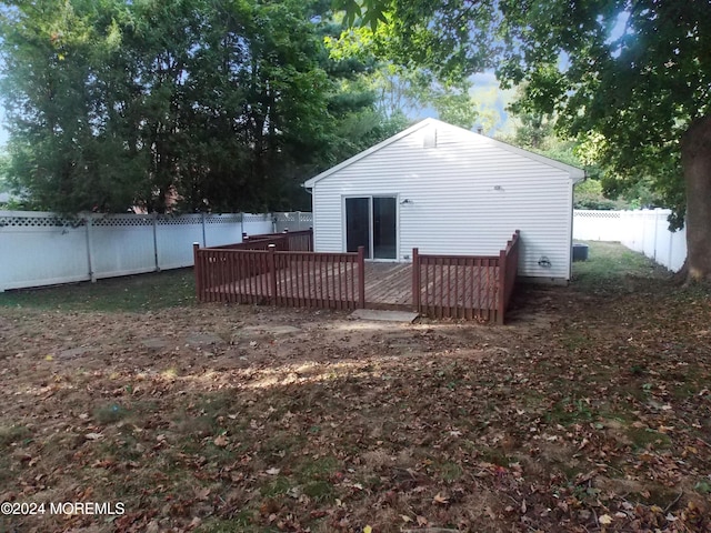 back of property featuring a deck