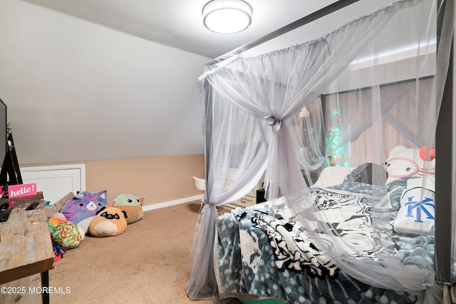 carpeted bedroom with baseboards and vaulted ceiling