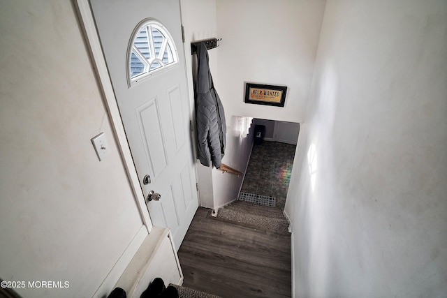 staircase featuring wood finished floors