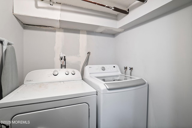 washroom featuring washing machine and dryer