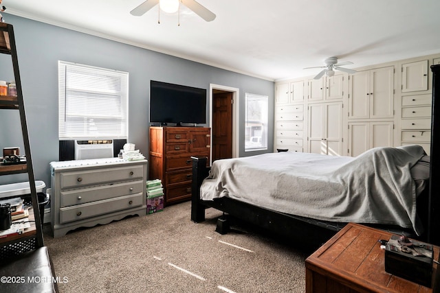 carpeted bedroom with a ceiling fan, crown molding, and cooling unit