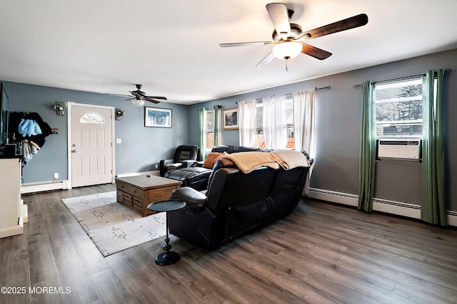 living area with a baseboard radiator, dark wood finished floors, ceiling fan, and cooling unit