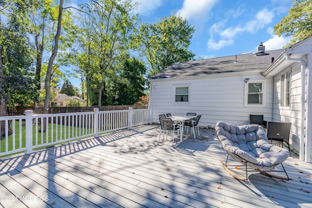 wooden terrace with a yard