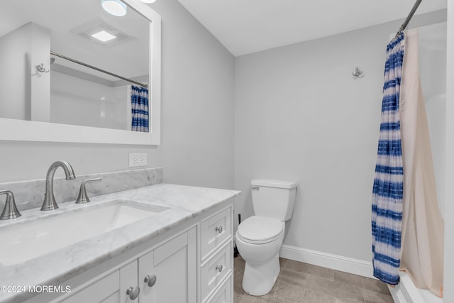 bathroom with vanity, toilet, and curtained shower