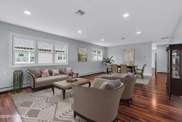 living room featuring a baseboard radiator and dark hardwood / wood-style flooring