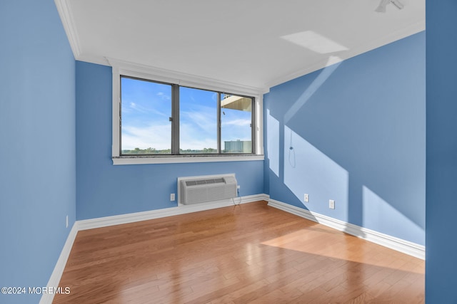 interior space with a wall unit AC and hardwood / wood-style flooring