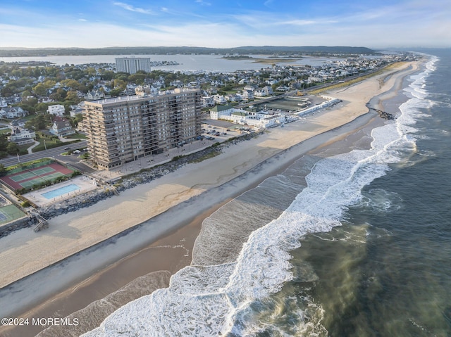 bird's eye view with a beach view and a water view