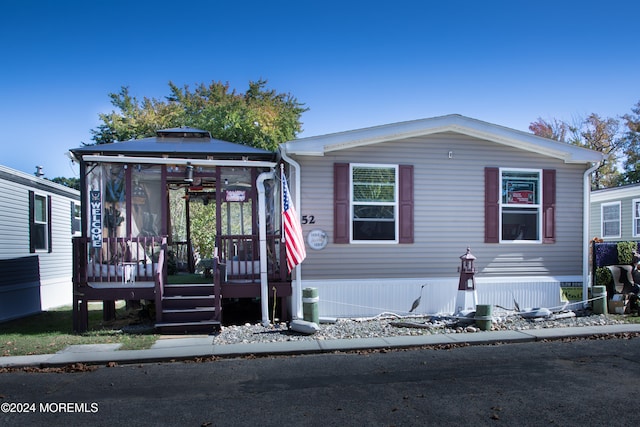 manufactured / mobile home with a gazebo and a deck