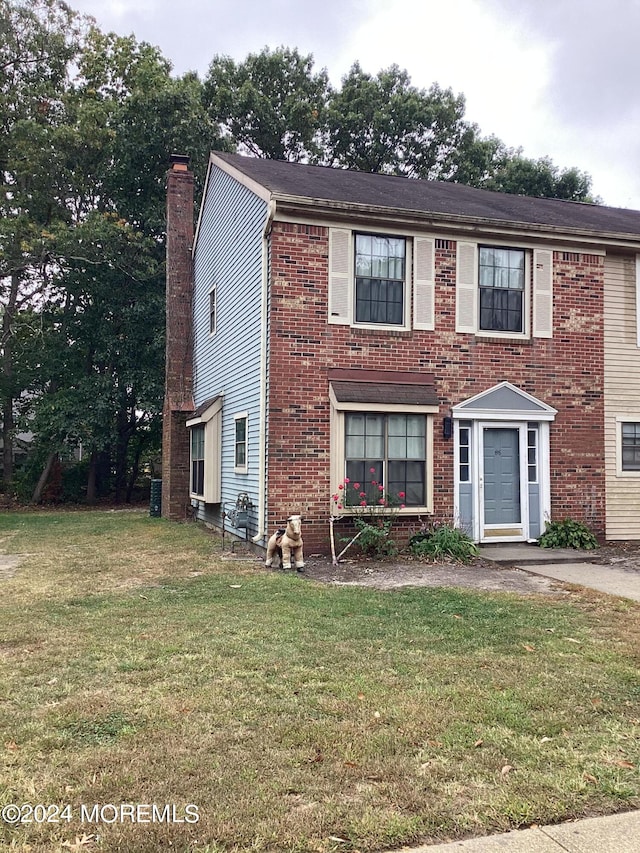 view of front of home with a front lawn