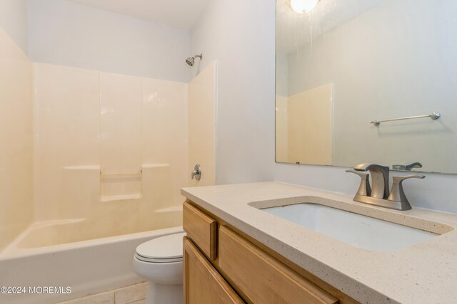 full bathroom with shower / bathing tub combination, vanity, toilet, and tile patterned floors