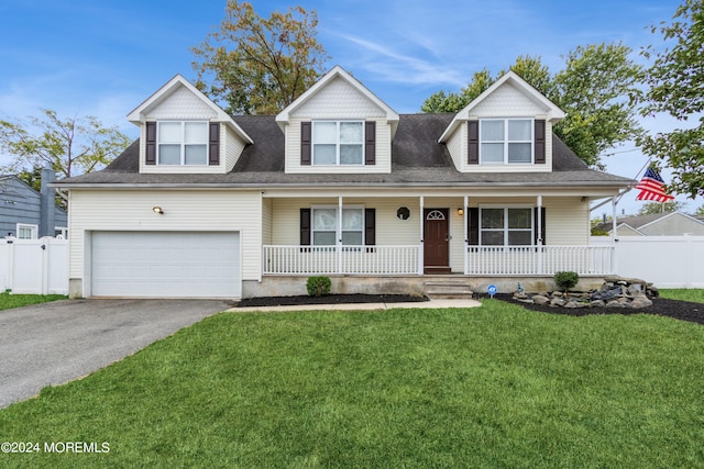 new england style home with a garage, a porch, and a front lawn