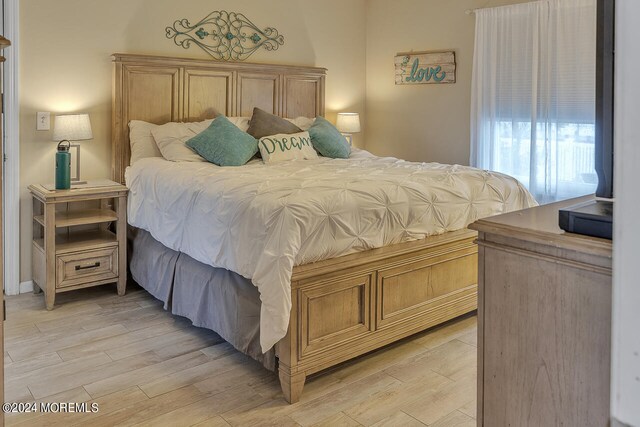 bedroom with light hardwood / wood-style flooring