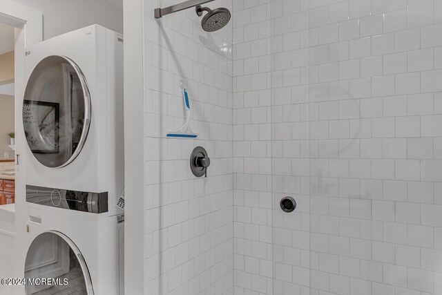 washroom with stacked washer and dryer