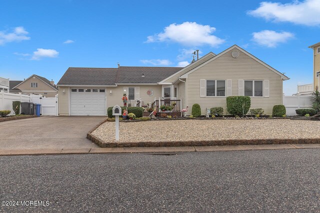 single story home featuring a garage