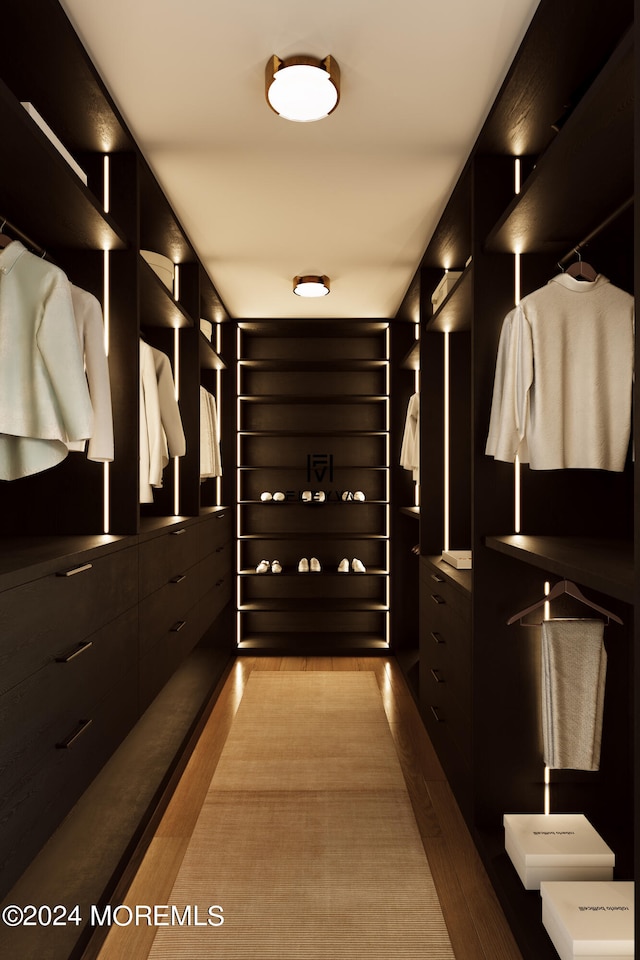 walk in closet featuring light wood-type flooring