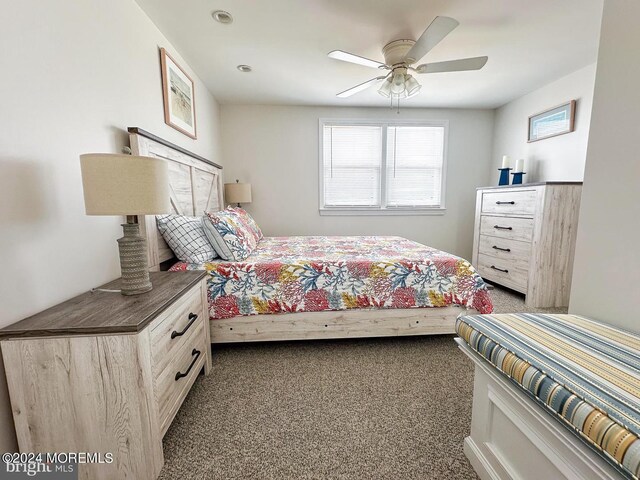 bedroom featuring ceiling fan and carpet floors