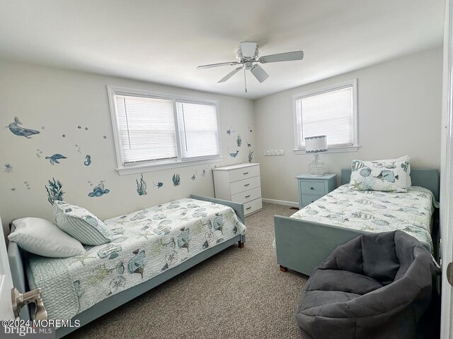 bedroom with ceiling fan and carpet flooring