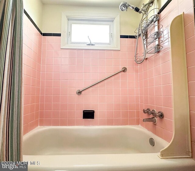 bathroom with shower / bath combo