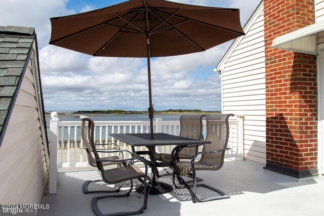 view of patio / terrace with a water view