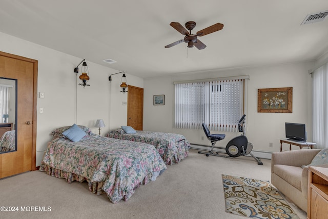 bedroom featuring baseboard heating, ceiling fan, and light colored carpet