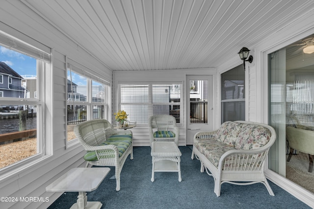 sunroom / solarium featuring wooden ceiling