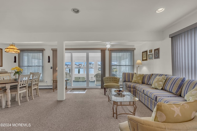 living room with carpet floors, ceiling fan, and a baseboard radiator