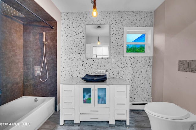 full bathroom with tiled shower / bath combo, vanity, toilet, and wood-type flooring