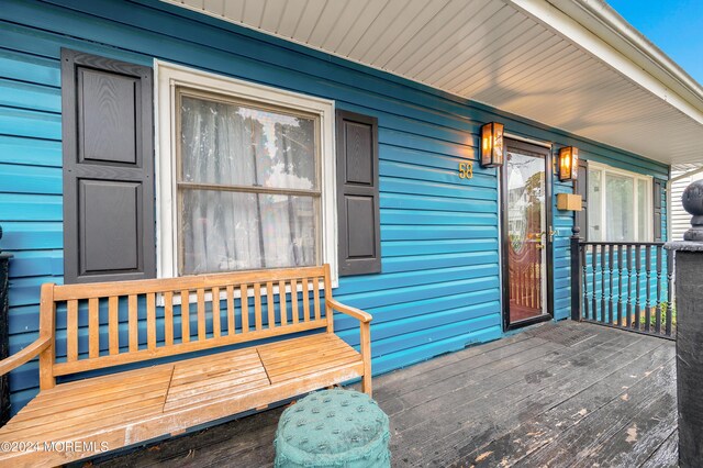 wooden terrace with a porch