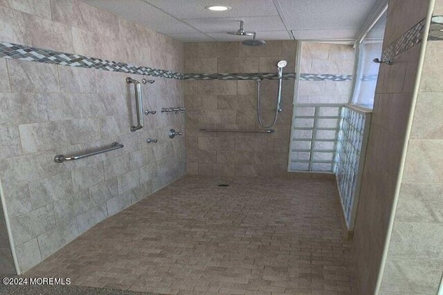 bathroom with tiled shower