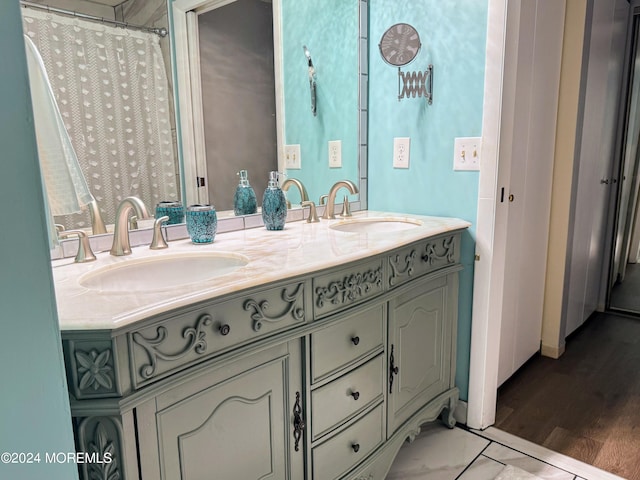 bathroom with wood-type flooring and vanity