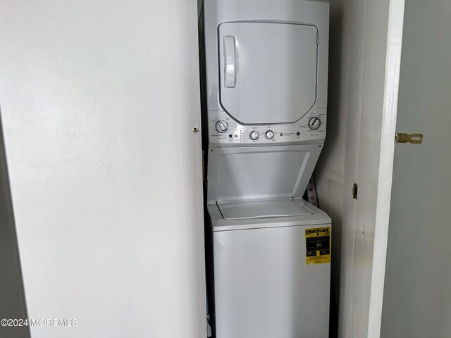 laundry room featuring stacked washer and clothes dryer