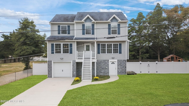 view of front of home featuring a front lawn and a garage